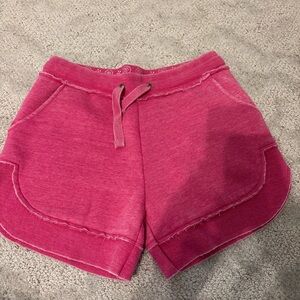 Pink Athletic Shorts with Drawstring Waistband and Curved Hem
